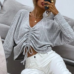 Drawstring over sized shirt.